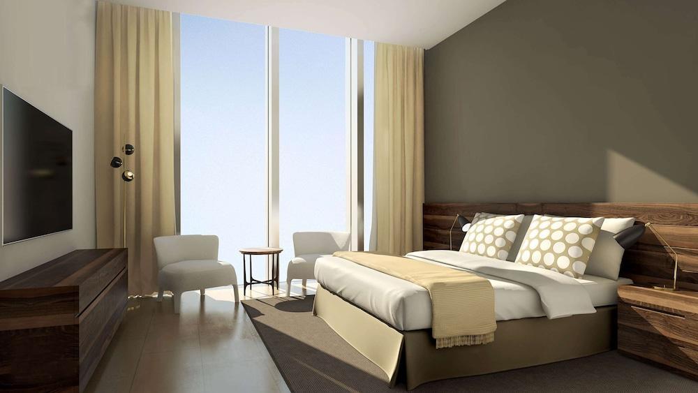 Aleph Doha Residences, Curio Collection By Hilton Zewnętrze zdjęcie A bedroom