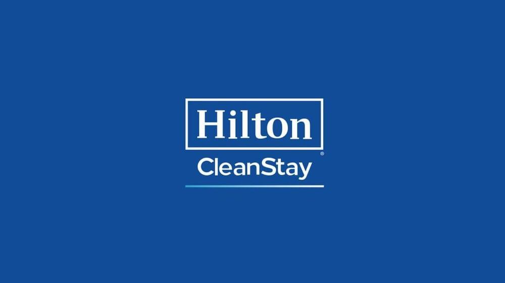 Aleph Doha Residences, Curio Collection By Hilton Zewnętrze zdjęcie Hilton CleanStay logo